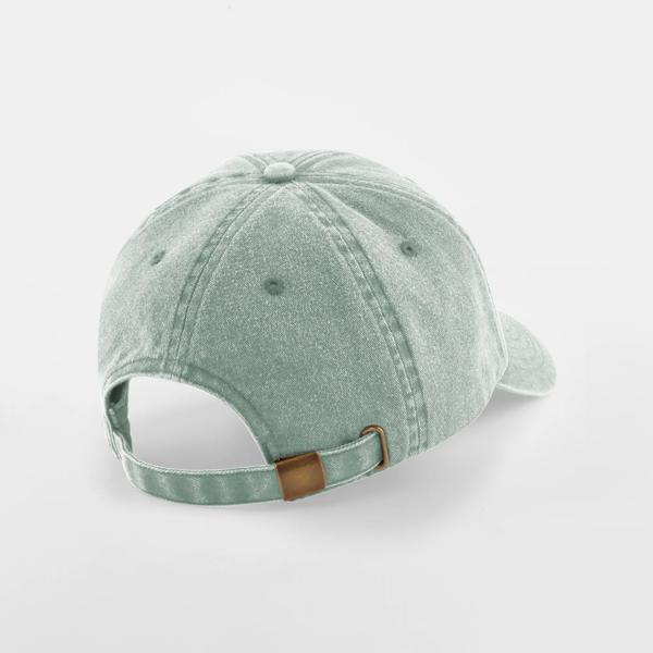 Parte trasera de la gorra vintage con cierre de tela y hebilla en acabado latón